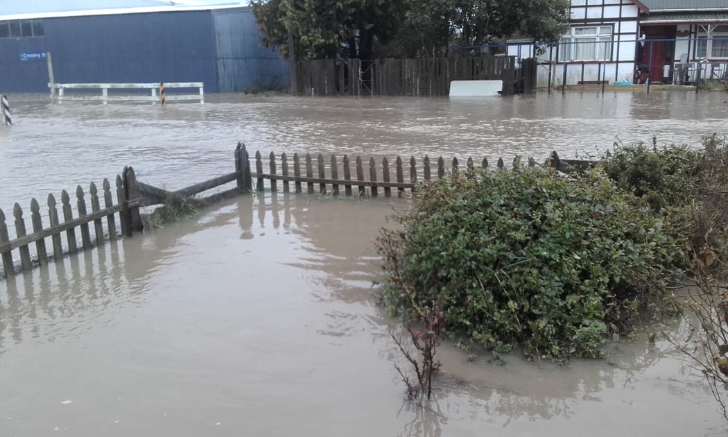 Flooding at the Lamberts' front fence.