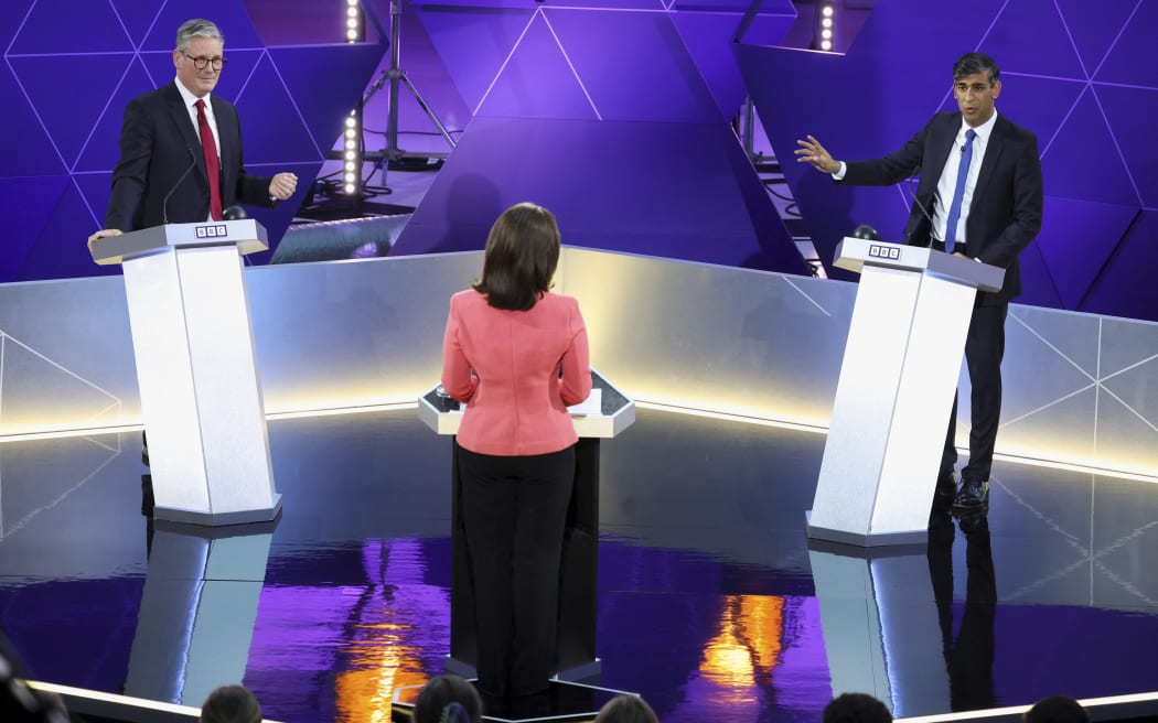 FILE - British Prime Minister Rishi Sunak and opposition Labour Party leader Keir Starmer, left, take part in a BBC debate, in Nottingham, England, Wednesday June 26, 2024.