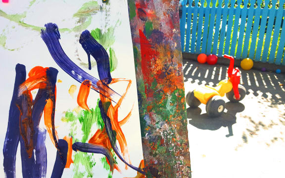 Painting and tricycle at early childhood centre