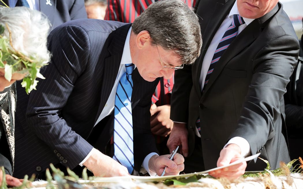 Chris Finlayson signing of the Whanganui River Treaty Settlement.