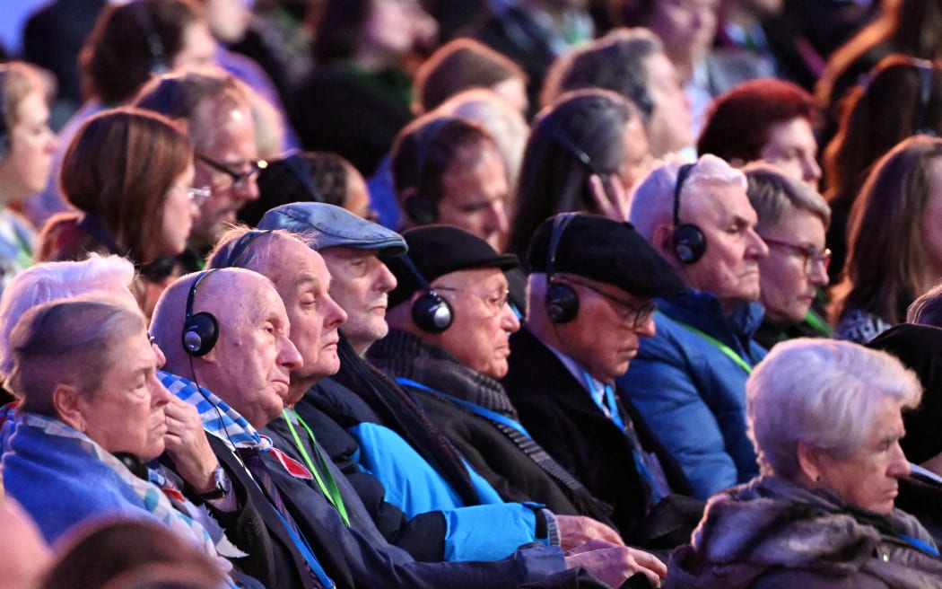 Holocaust survivors attend commemorations on the 80th anniversary of the liberation of the German Nazi concentration and extermination camp Auschwitz-Birkenau by the Red Army, in Oswiecim, Poland on January 27, 2025. (Photo by Sergei GAPON / AFP)