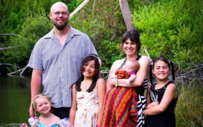 A family photo with (from left) Isis, Robin, Tia-Bella, Tara holding Cordelia and Majenta.