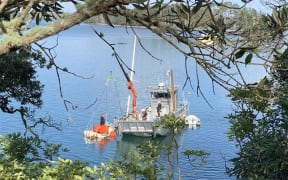 Harbourmaster team refloating sunken boat at Tanners Point.