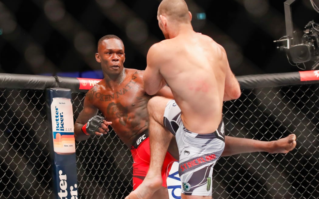 Israel Adesanya and Sean Strickland in action at UFC 293 in Sydney.