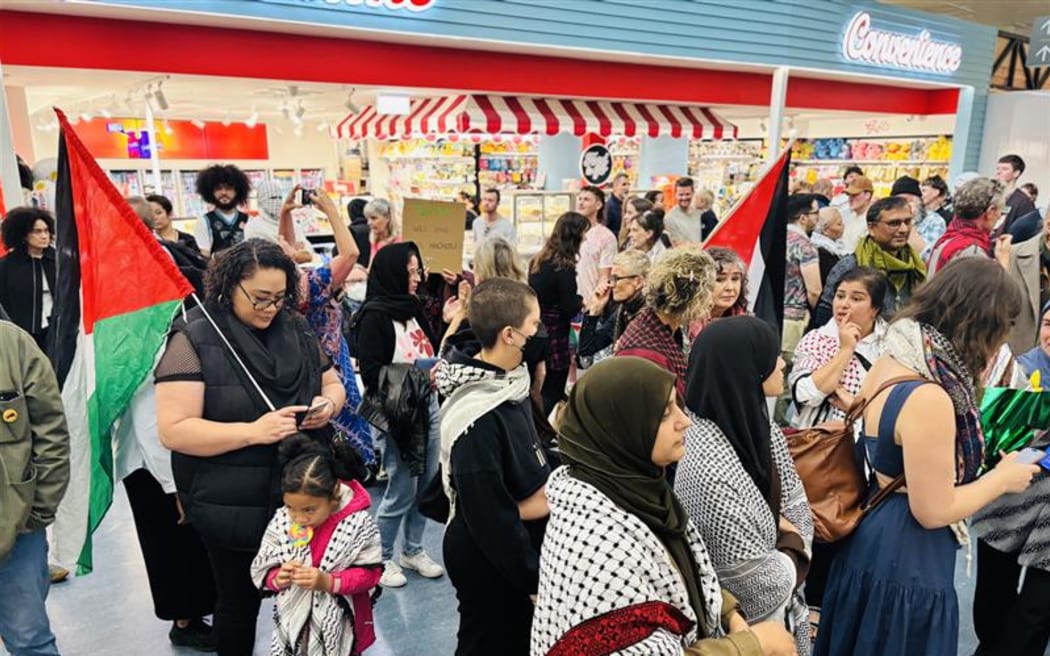People gathered at Auckland Airport to welcome home the New Zealanders who were on the flotilla to Gaza.