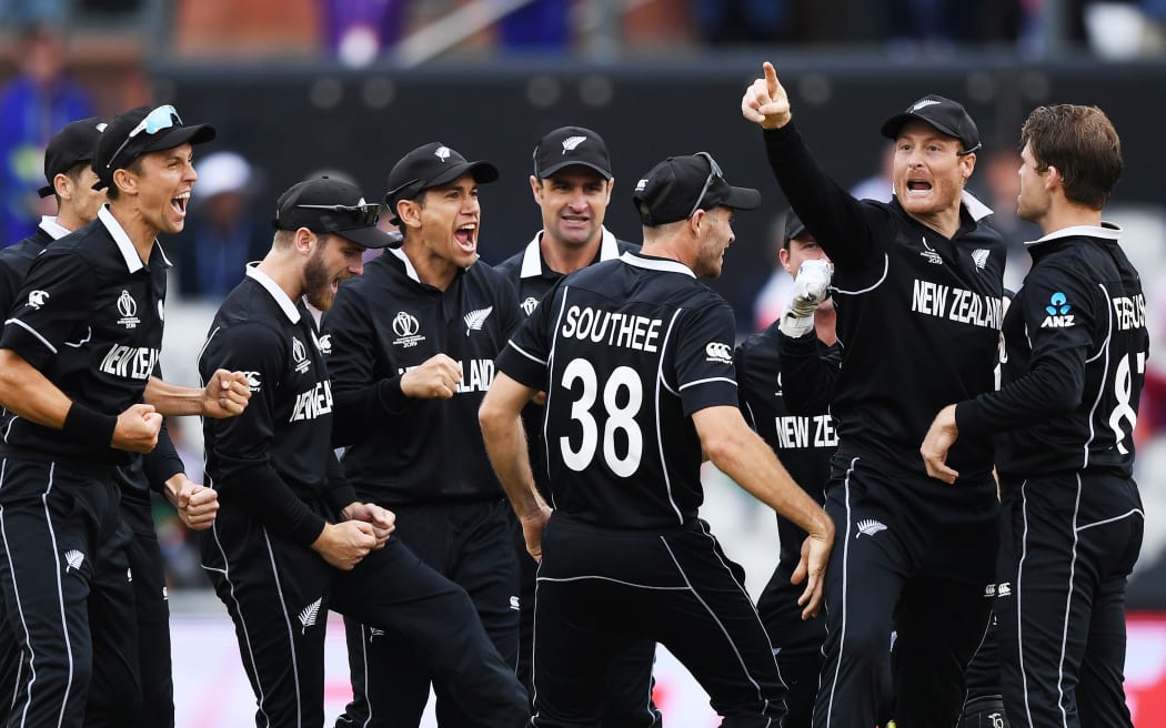 The Black Caps celebrate the run out of M S Dhoni at Old Trafford.