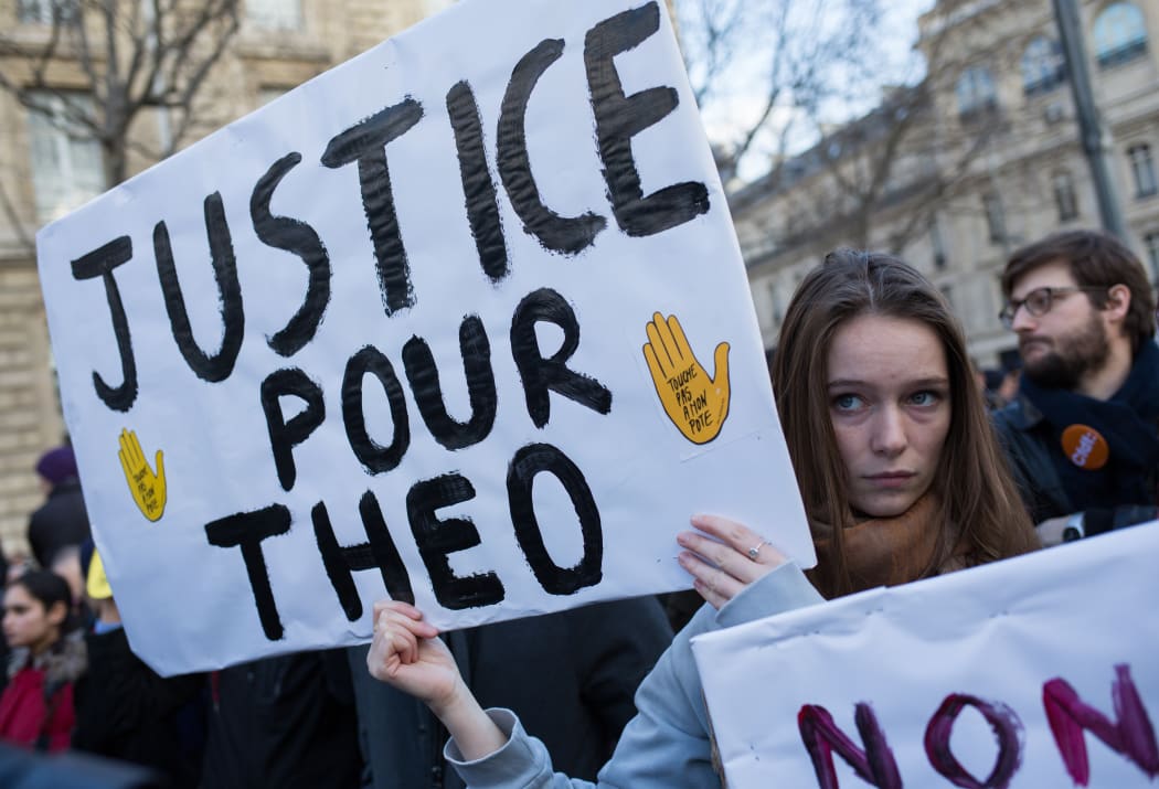 A rally in Paris against police violence when they arrested a young man called Theo in early February.