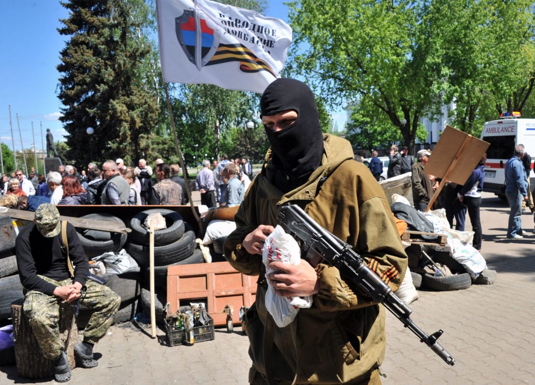 Pro-Russian militants guard a barricade outside the regional state building in Kramatorsk, eastern Ukraine.