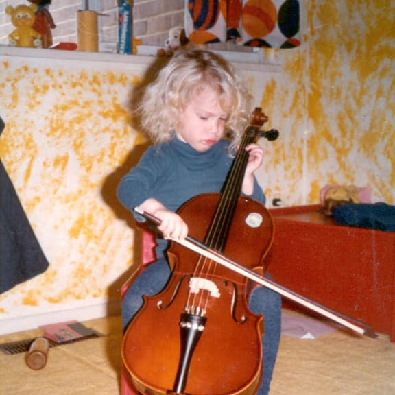 Inbal Megiddo, playing the cello as a child.