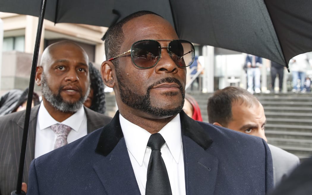 R Kelly leaves court after a hearing on sexual abuse charges earlier this month.