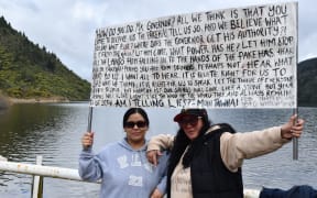 Blair and Kenzie Moke hold the speech their koro Mohi Tāwhai made when signing Te Tiriti o Waitangi in 1840. Photo / Laura Smith