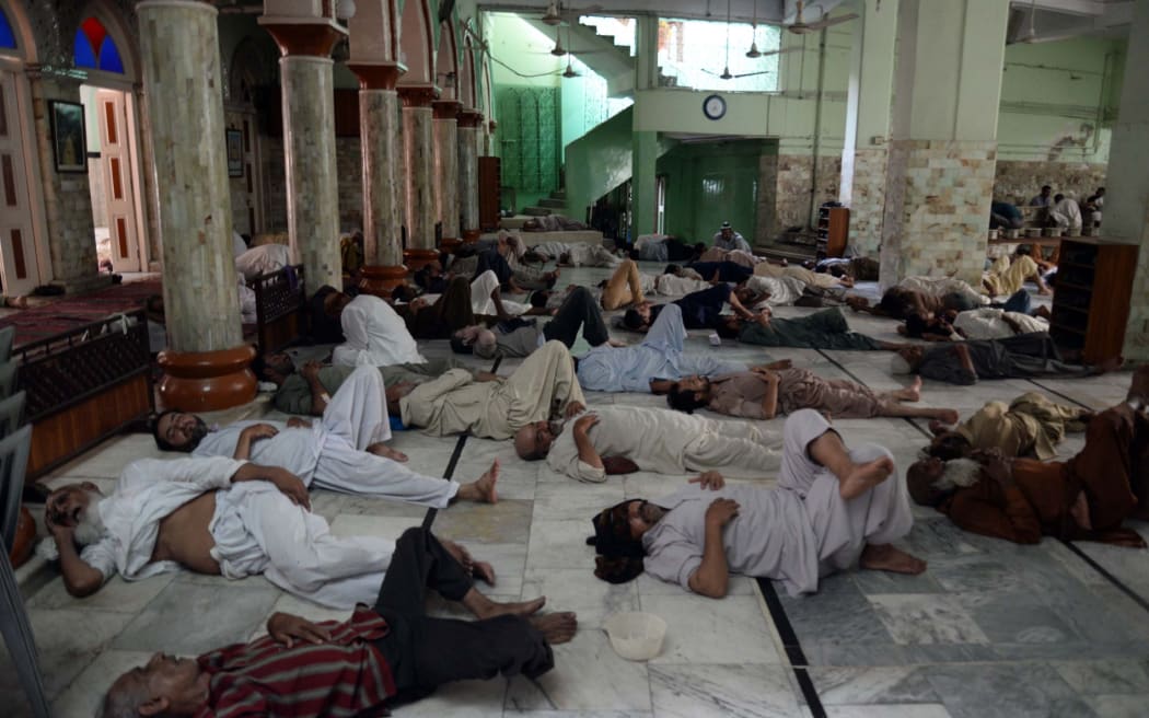 As the thermometer reaches 45 degrees in Karachi, people struggle to move during the fasting month of Ramadan.