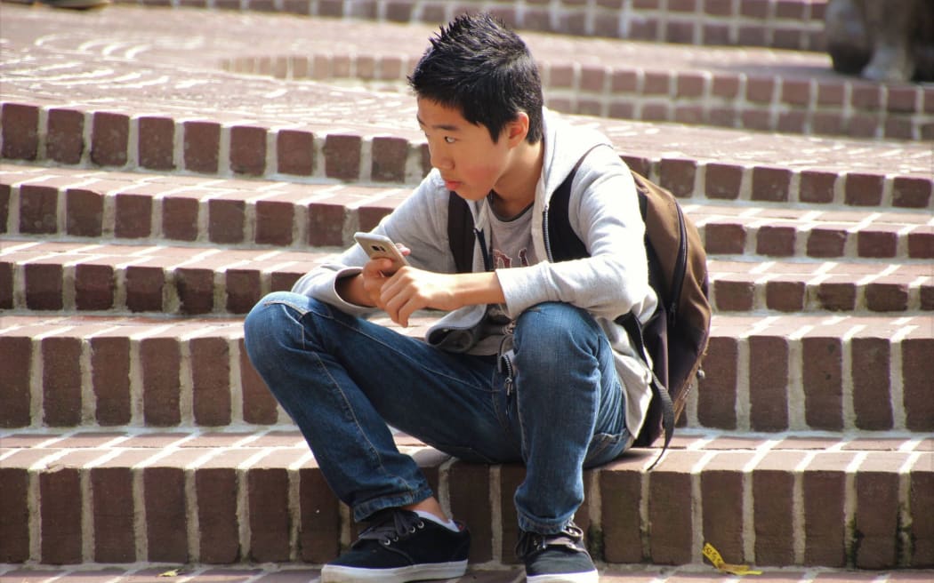 Asian boy on steps