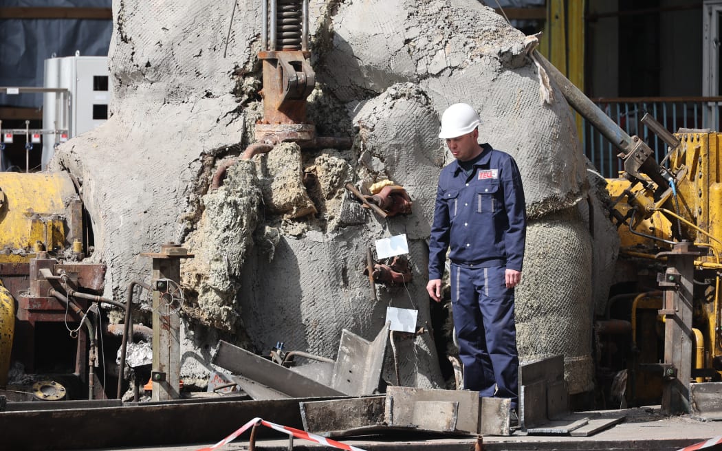 A worker is inspecting the damage at the Kharkiv Combined Heat and Power Plant (CHP) in the Kharkiv Region, northeastern Ukraine, on April 11, 2024, after it was damaged by Russian shelling. (Photo by Ukrinform/NurPhoto) (Photo by Vyacheslav Madiyevskyy / NurPhoto / NurPhoto via AFP)