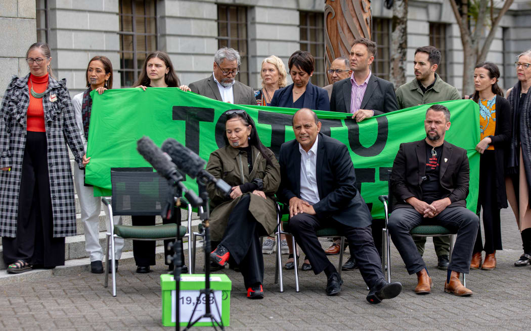 Rueben Taipari deliver sign petitions to parliament