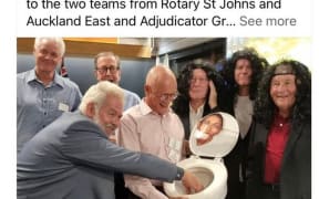 A screenshot of the now-deleted post taken by the New Zealand Herald shows a group of men surrounding the toilet seat with a caricature of former Prime Minister Jacinda Ardern seemingly stuck to the lid.