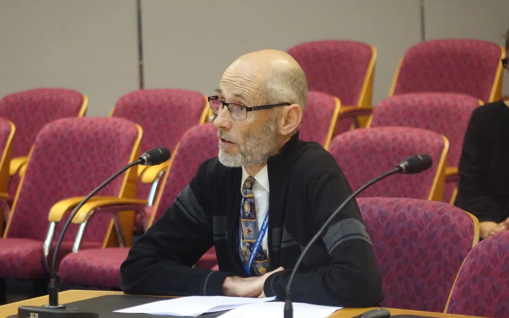 Taranaki medical officer of health Jonathan Jarman makes his submission on the number of pokie machines.