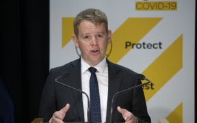 -POOL- Photo by Mark Mitchell: Covid-19 Response Minister Chris Hipkins  during the Delta outbreak update with director general of health Dr Ashley Bloomfield at Parliament, Wellington.   20 October, 2021. NZ Herald photograph by Mark Mitchell