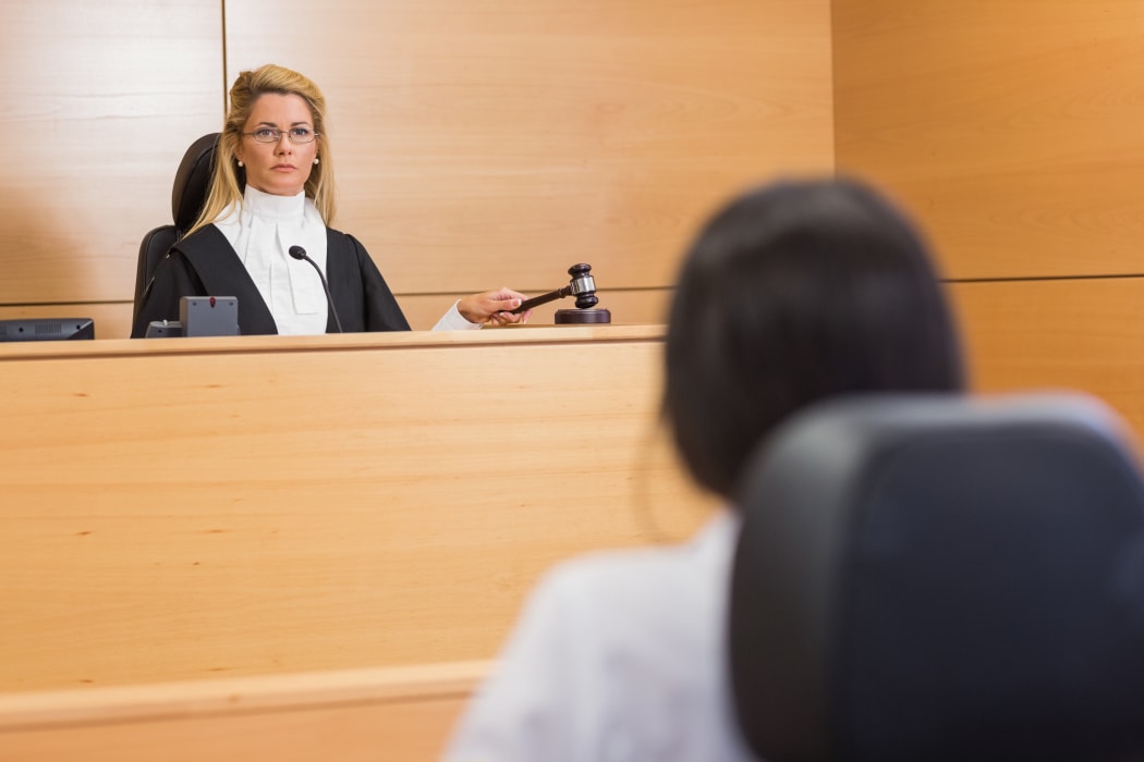 Lawyer listening to the judge in the court room