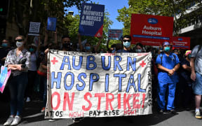 New South Wales public hospital nurses participate in a strike over staff shortages, pandemic-related stresses and pay rates in Sydney on 15 February 2022.