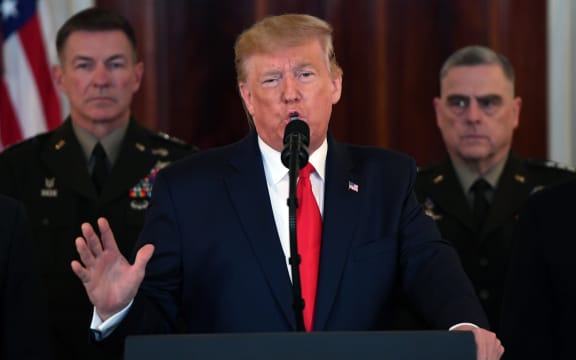 US President Donald Trump speaks about the situation with Iran in the Grand Foyer of the White House.