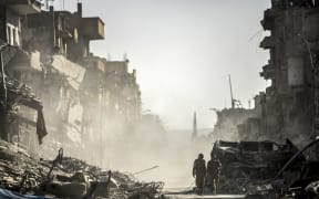 Fighters from the Syrian Democratic Forces (SDF) in Raqqa after a Kurdish-led force expelled Islamic State (IS) group fighters.