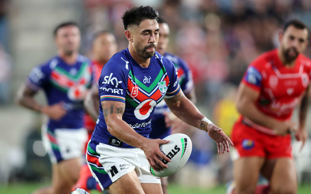 Shaun Johnson prepares to make a kick in the Warriors round one match against the Dragons.