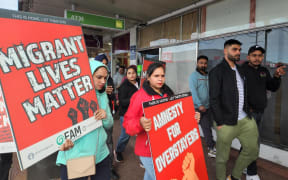An anti-exploitation protest marches through the Papatoetoe town centre.