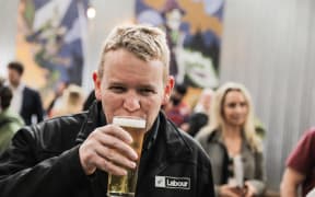 Labour leader Chris Hipkins having a beer at Boneface, in Upper Hutt, after a day campaigning on 6 October, 2023.