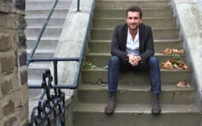 Chris Tubbs in front of his flat in Camden North London, 2011.