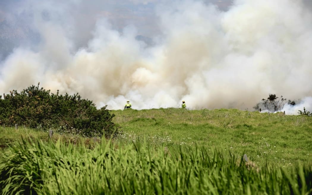 Firefighters battle a blaze in Millwater, Auckland, on 7 November 2025.