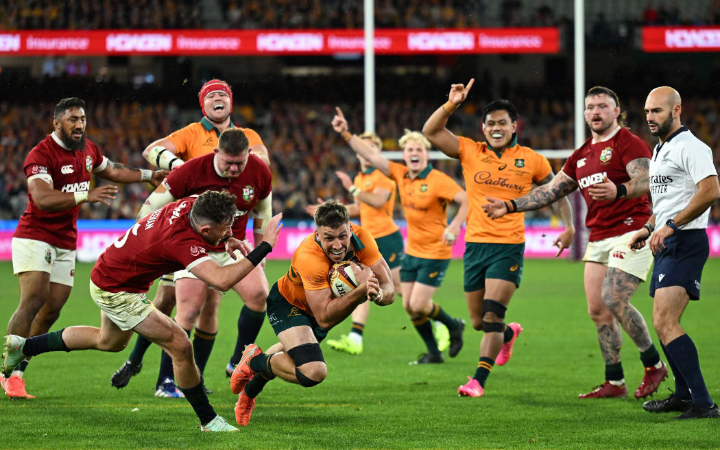 Jake Gordon of Australia dives to score a try during the second test against the British and Irish Lions.