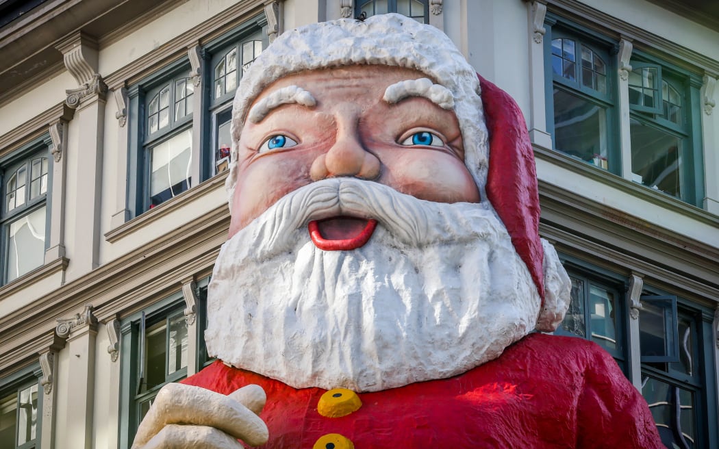 Large santa statue mounted to a building in Auckland's central city