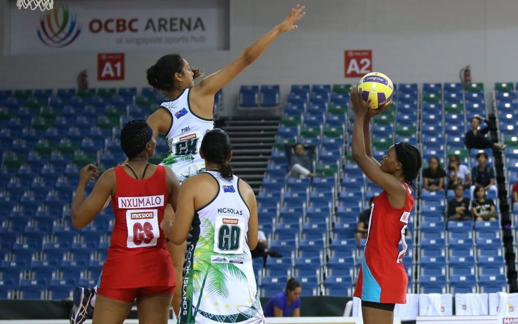 Cook Islands GK Anania Pauleen Piri leaps high v Swaziland