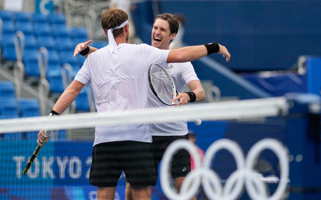 New Zealand's Michael Venus (left) hugs Marcus Daniell after they defeated Americans Krajicek / Sandgren to win the bronze medal in the men's doubles at Ariake Tennis Park, Tokyo 2020 Olympic Games. Friday 30 July 2021.