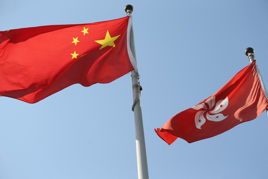 China national flag and Hong Kong flag wave in Hong Kong on Oct 10, 2020.