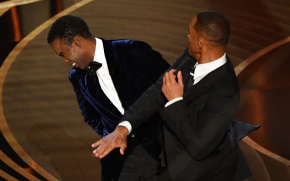 US actor Will Smith slaps US actor Chris Rock onstage during the 94th Oscars at the Dolby Theatre in Hollywood, California on March 27, 2022.