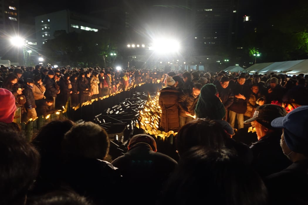 A moment's silence in Higashi-Yuenchi Park to remember the more than 6000 who died in the Kobe quake.