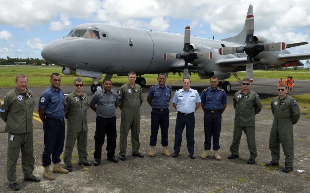 Members of the Fiji Navy and Ministry of Fisheries and New Zealand Air Force crew in front of the Orion.