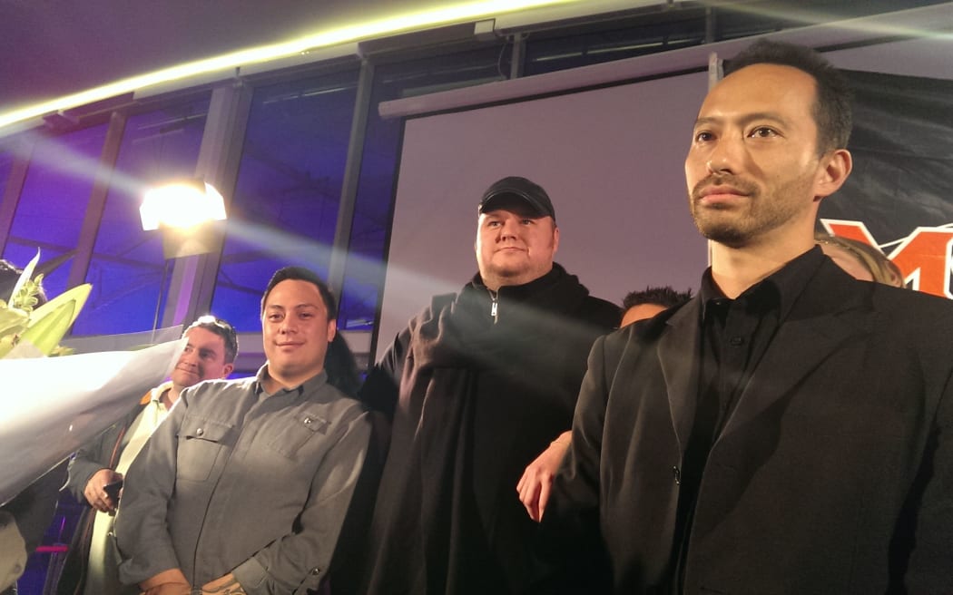 Kim Dotcom (centre) said his brand was "poison for what we were trying to achieve."