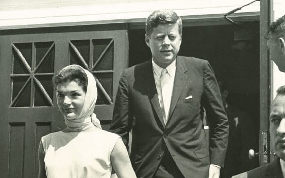 Keeping a watchful eye as Presidentand Mrs. Kennedy exit St. FrancisXavier Church in Hyannis Port.
