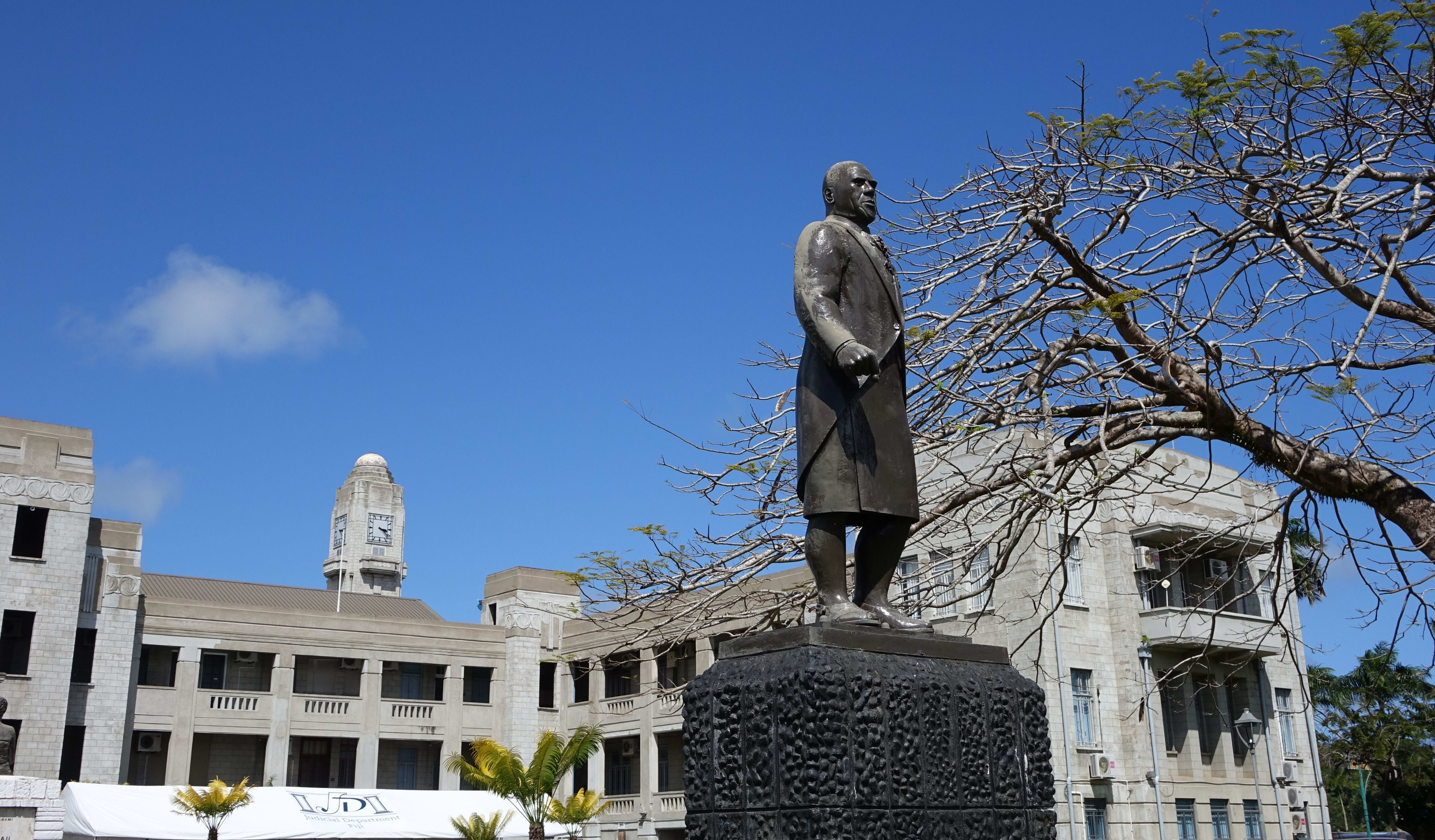 A statue of the Fiji statesman Ratu Sir Lala Sukuna stands guard outside Fiji's government buildings, Suva