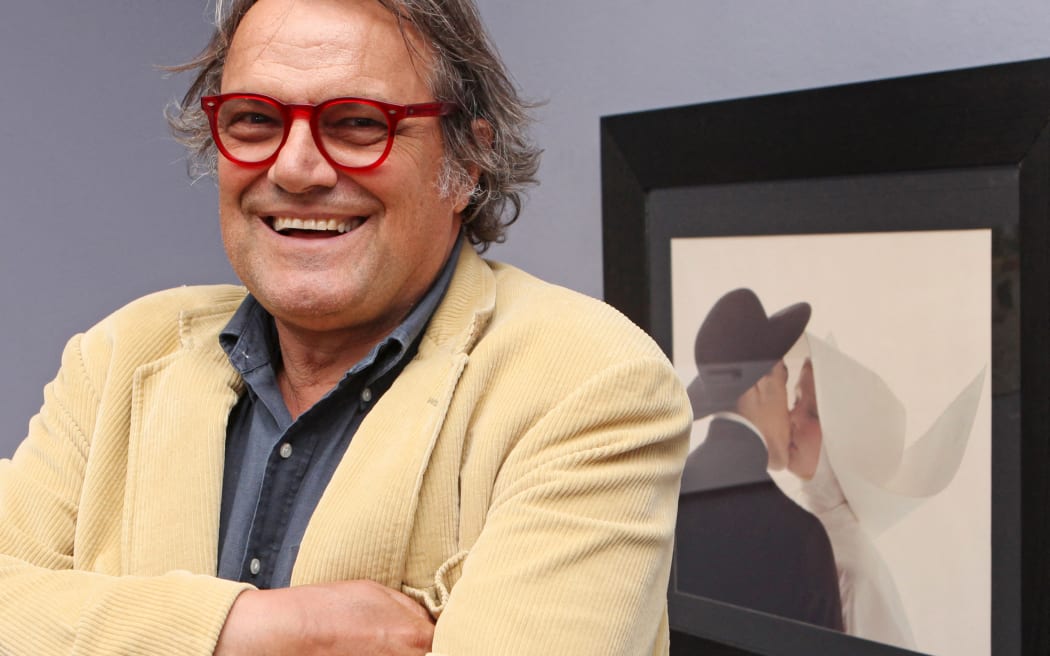 Italian Photographer Oliviero Toscani, in front of his picture "Kissing Nun" at an exhibition entitled "controversy, justice, ethics and photography" in a Vienna gallery, in 2010.