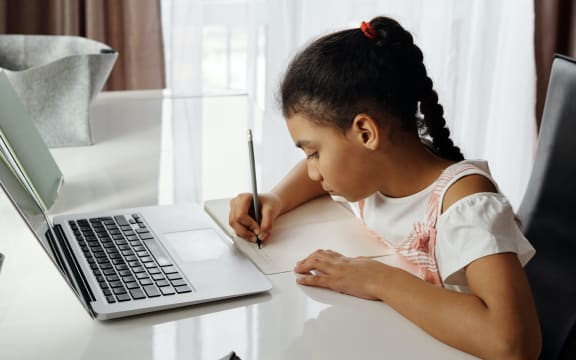 a young girl studying