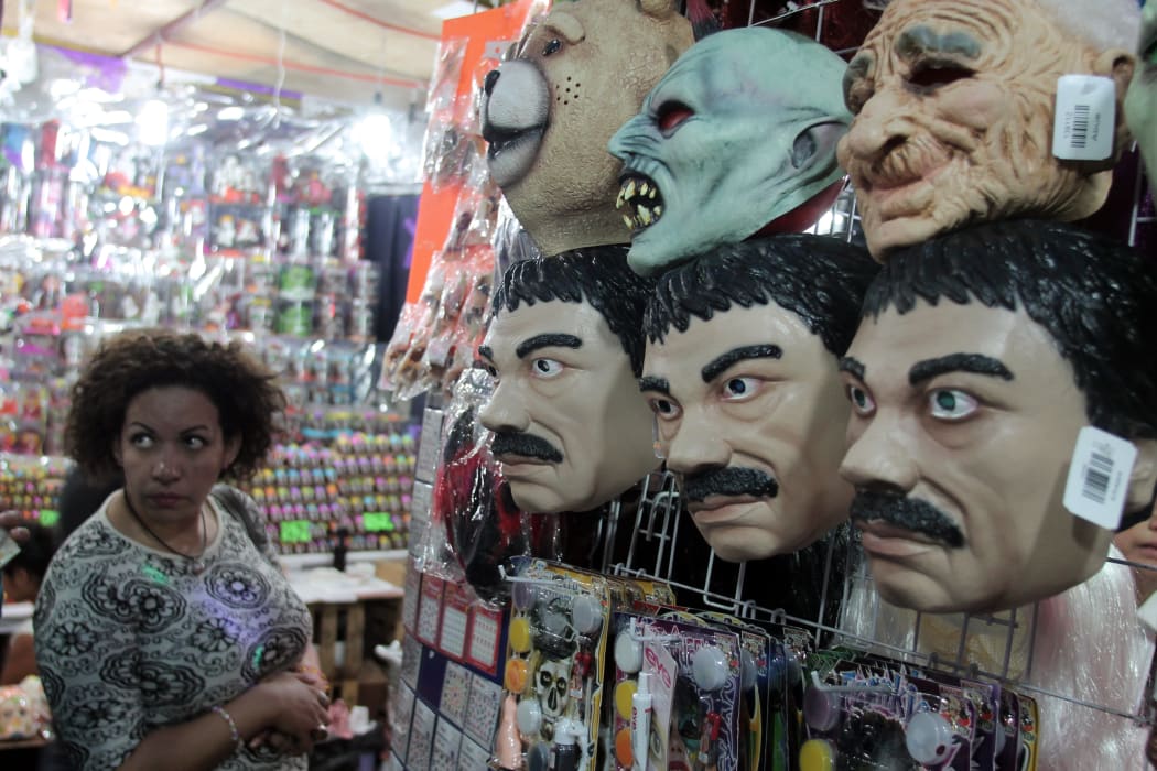 Masks of famous Mexican drug trafficker currently on the run Joaquin Guzman Loera 'El Chapo' are pictured in a costume shop in central Mexico.