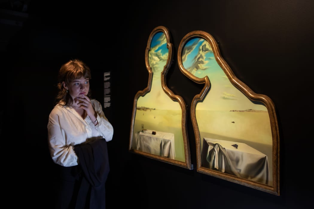 India from Kingston, Wellington, views Salvador Dalí's Couple With Their Heads Full Of Clouds, 1936, in Te Papa's Surrealist Art: Masterpieces from Museum Boijmans Van Beuningen exhibition.