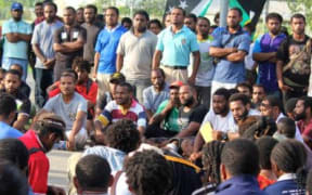 Students gather on the UPNG campus.