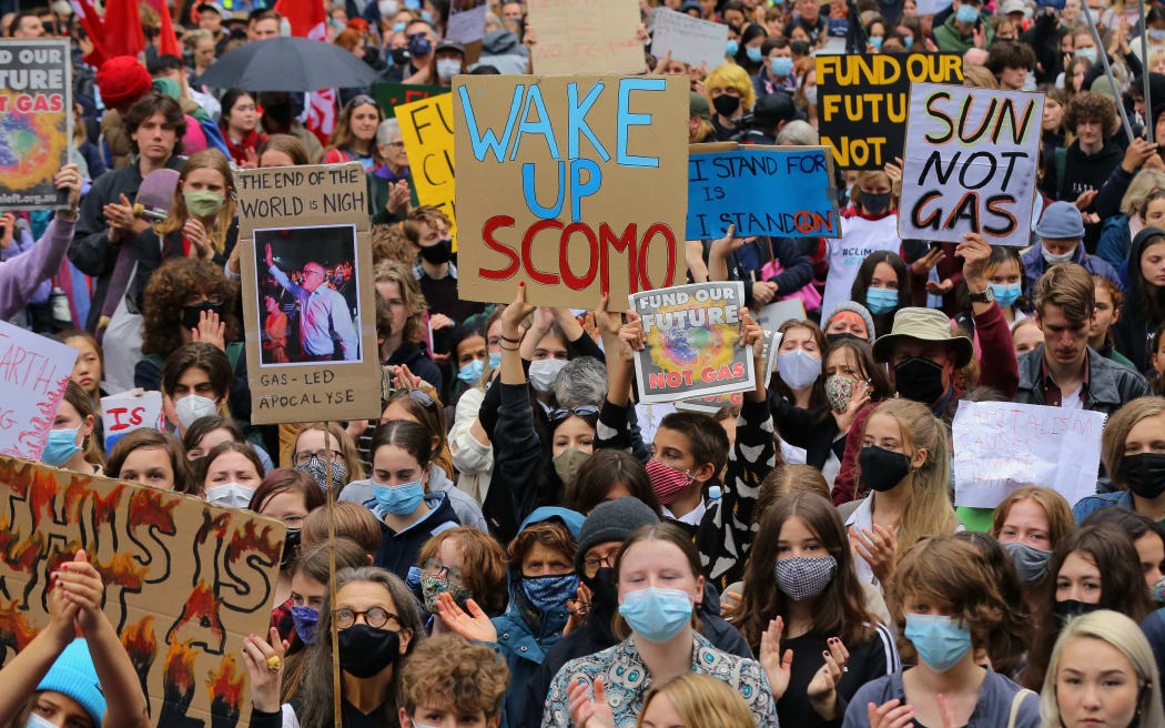 SYDNEY, AUSTRALIA - MAY 21: Students and other protesters hold placards during a climate protest organised by School Strike 4 Climate Australia (SS4C) in Sydney, Australia, on May 21, 2021.