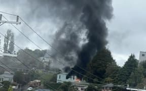 Fire and Emergency has sent out a smoke warning in Dunedin as crews battle a fire in the Roslyn Scout Hall.