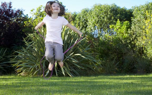 Young girl jumping in the air